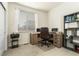 Bright home office features built-in shelving and large window at 12243 Joplin St, Commerce City, CO 80603