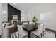 Modern dining room with view of living area and fireplace at 8748 Redwing Ave, Littleton, CO 80126