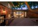 Back yard featuring a spacious wood deck, mature tree with string lights, and privacy fencing at 4634 W Tufts Cir, Denver, CO 80236