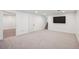 Spacious basement room with neutral carpet, white walls, and recessed lighting, perfect for a home theater at 4634 W Tufts Cir, Denver, CO 80236
