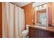 Bathroom featuring a shower with a curtain, a toilet, and a vanity with a sink and granite countertop at 4634 W Tufts Cir, Denver, CO 80236