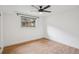 This bedroom boasts hardwood floors and a bright window at 4634 W Tufts Cir, Denver, CO 80236