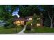 Charming two-story brick home with lush landscaping and mature trees in a tranquil setting at 4634 W Tufts Cir, Denver, CO 80236