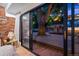 Inviting outdoor space with a large tree, string lights, a deck, and a door at 4634 W Tufts Cir, Denver, CO 80236