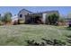 Expansive backyard featuring a covered patio and manicured lawn at 5759 E Geddes Cir, Centennial, CO 80112