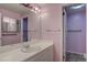 Bathroom featuring pink walls, a large mirror, and a single sink vanity at 5759 E Geddes Cir, Centennial, CO 80112
