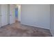 Bright bedroom with neutral walls, carpet flooring, and interior door at 5759 E Geddes Cir, Centennial, CO 80112