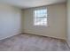 Cozy bedroom with large window offering bright natural light and neutral wall color at 5759 E Geddes Cir, Centennial, CO 80112