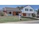 Beautiful home with a green lawn, brick facade, and a 'For Sale' sign in the yard at 5759 E Geddes Cir, Centennial, CO 80112