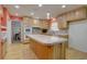 Eat in kitchen with light wood cabinets, light countertops, large island and stainless steel appliances at 5759 E Geddes Cir, Centennial, CO 80112