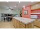 Eat in kitchen with light wood cabinets, light countertops, large island and eat in breakfast table at 5759 E Geddes Cir, Centennial, CO 80112