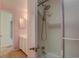 Bathroom featuring walk-in shower with grab bar and neutral tile surround at 5759 E Geddes Cir, Centennial, CO 80112