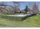 Community swimming pool surrounded by well-maintained grassy areas and a sturdy black fence, providing a secure recreational space at 5759 E Geddes Cir, Centennial, CO 80112