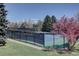 High angle view of the community's pristine tennis court offering a beautiful playing surface and secure perimeter fencing at 5759 E Geddes Cir, Centennial, CO 80112
