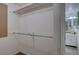 Spacious walk-in closet featuring built-in shelving and access to the bathroom at 5759 E Geddes Cir, Centennial, CO 80112