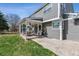Backyard featuring a covered patio area with grill, and ceiling fan at 762 Hughes Ln, Highlands Ranch, CO 80126