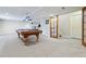 Finished basement featuring a pool table and ample space for recreation and relaxation at 762 Hughes Ln, Highlands Ranch, CO 80126