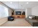 Finished basement featuring plush carpeting, a large entertainment center, and comfortable seating at 762 Hughes Ln, Highlands Ranch, CO 80126