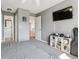 Comfortable bedroom with mounted TV, carpeting, and easy access to adjoining rooms at 762 Hughes Ln, Highlands Ranch, CO 80126