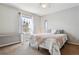 Cozy bedroom featuring a ceiling fan, window, neutral walls, and carpeted floors at 762 Hughes Ln, Highlands Ranch, CO 80126