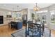 Stylish kitchen with granite countertops, stainless steel appliances, and center island with seating at 762 Hughes Ln, Highlands Ranch, CO 80126