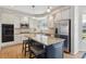 Gourmet kitchen with stainless appliances, an island with barstool seating and ample counter space for cooking prep at 762 Hughes Ln, Highlands Ranch, CO 80126