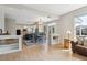 Open-concept living space with hardwood floors seamlessly connecting the living room and kitchen at 762 Hughes Ln, Highlands Ranch, CO 80126