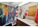 Vibrant bathroom with graffiti-themed shower curtain and unique art providing a modern and artistic flair at 750 S Clinton St # 6B, Denver, CO 80247