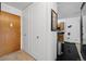 Inviting entryway with coat closet leads to the home interior at 750 S Clinton St # 6B, Denver, CO 80247