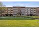 Front view of the apartment building with landscaping at 750 S Clinton St # 6B, Denver, CO 80247