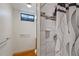 Bright bathroom with a modern shower, clean lines, and efficient layout at 6900 Avrum Dr, Denver, CO 80221