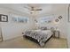 Sunlit bedroom featuring a comfortable bed, neutral decor, and bright natural light at 6900 Avrum Dr, Denver, CO 80221