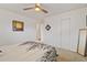 Airy bedroom featuring a spacious layout, closet, and bright natural light at 6900 Avrum Dr, Denver, CO 80221