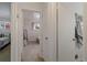 Bright hallway offering glimpses into nearby bedrooms, adding depth to the home's layout at 6900 Avrum Dr, Denver, CO 80221