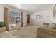 Bright living room with plush sofas, large windows, and a classic design at 6900 Avrum Dr, Denver, CO 80221