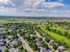 Aerial view of home near neighborhood green space, golf course, and walking trails at 11585 Decatur St # B, Denver, CO 80234