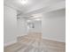Finished basement features neutral paint and carpet and exposed support beams at 11585 Decatur St # B, Denver, CO 80234