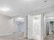 Finished basement with neutral carpet, lighting, and bathroom at 11585 Decatur St # B, Denver, CO 80234