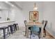 Dining area featuring an open layout, wood table, and kitchen bar seating at 11585 Decatur St # B, Denver, CO 80234