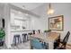 Dining area featuring an open layout, wood table, and kitchen bar seating at 11585 Decatur St # B, Denver, CO 80234