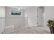 Second story hallway featuring neutral carpet and lots of light at 11585 Decatur St # B, Denver, CO 80234
