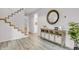 Hallway with hardwood floors, stairway, and decorative accents at 11585 Decatur St # B, Denver, CO 80234