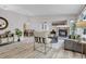 Spacious living room with a stone fireplace and view into a dining area at 11585 Decatur St # B, Denver, CO 80234