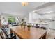 Open concept living and dining area with hardwood floors and lots of natural light at 11585 Decatur St # B, Denver, CO 80234