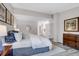 Bright main bedroom featuring luxury bedding, ensuite bathroom, and neutral paint at 11585 Decatur St # B, Denver, CO 80234