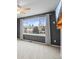 Bedroom featuring a large window with neighborhood views and dark grey walls at 6511 Shea Pl, Highlands Ranch, CO 80130