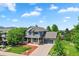 Beautiful home featuring a welcoming front porch, a well-kept lawn, and an attached garage at 18967 W 54Th Ln, Golden, CO 80403
