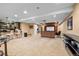 Open concept basement with bar, kitchen, theatre area, and workout space at 18967 W 54Th Ln, Golden, CO 80403