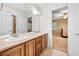 Bright bathroom features a double sink vanity and leads into another bedroom and bathroom area at 18967 W 54Th Ln, Golden, CO 80403