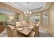 Elegant dining room with a chandelier and seating for six, adjacent to the living area at 18967 W 54Th Ln, Golden, CO 80403